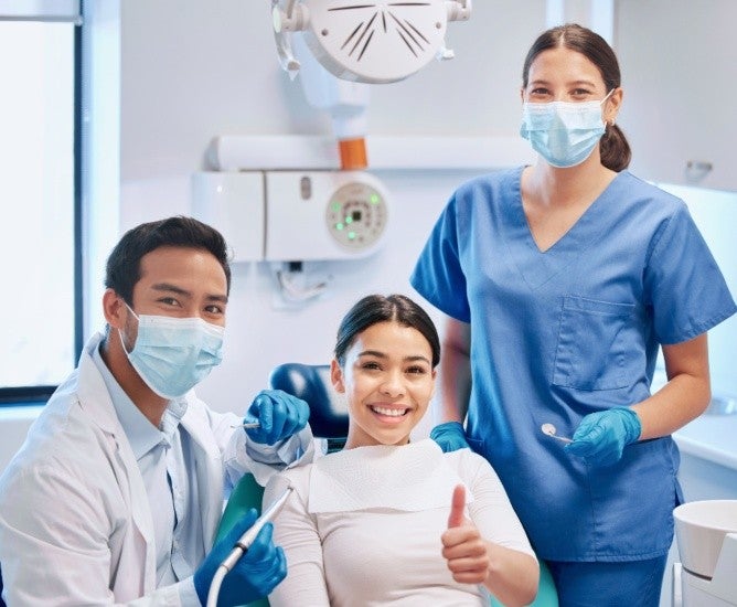 woman getting teeth treatment