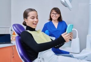 Happy patient smiling brightly after undergoing a smile makeover procedure in Millersville, MD