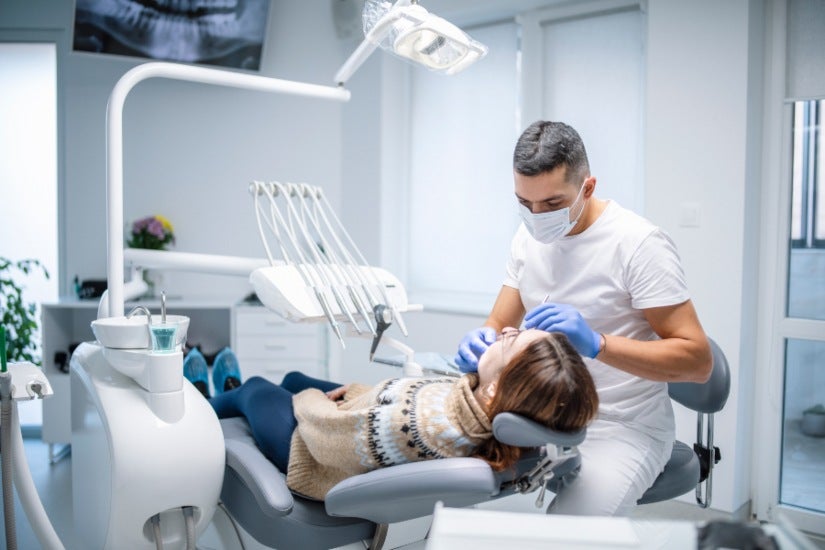 Dental scaling and root planing procedure being performed on a patient's teeth in Millersville, MD