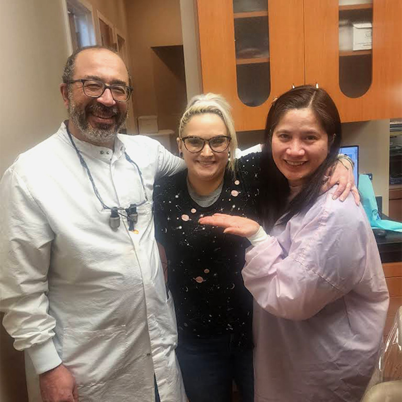 dentists smiling with patient