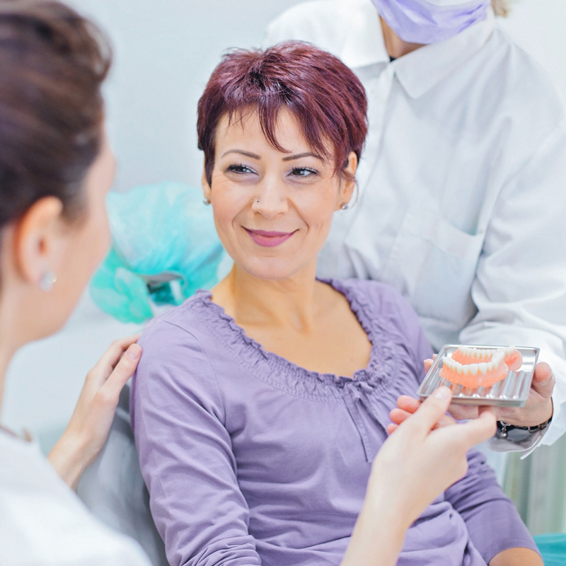 lady smiling with dentures from dentist