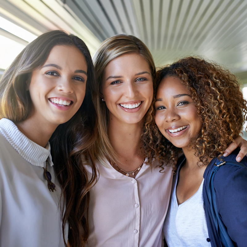 three woman smiling