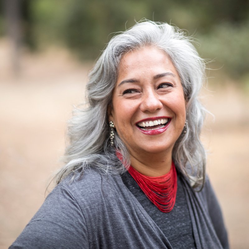 Woman smiling confidently after professional dental treatment at a dental clinic in Millersville, MD